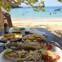 Eating fresh lobster on the beach dominican republic